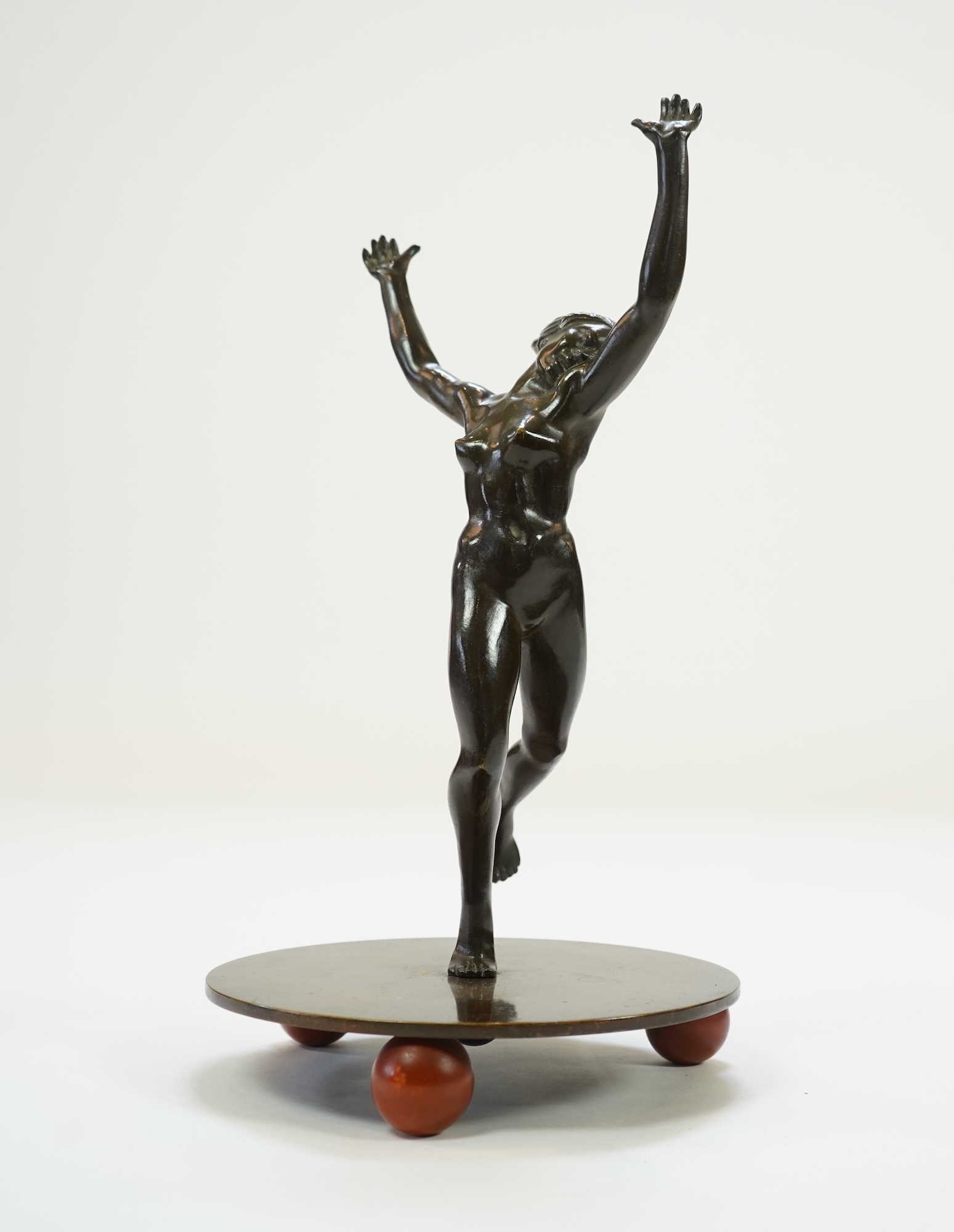 An Art Deco Austrian patinated bronze of a nude female dancer in the manner of Otto Hafenrichter